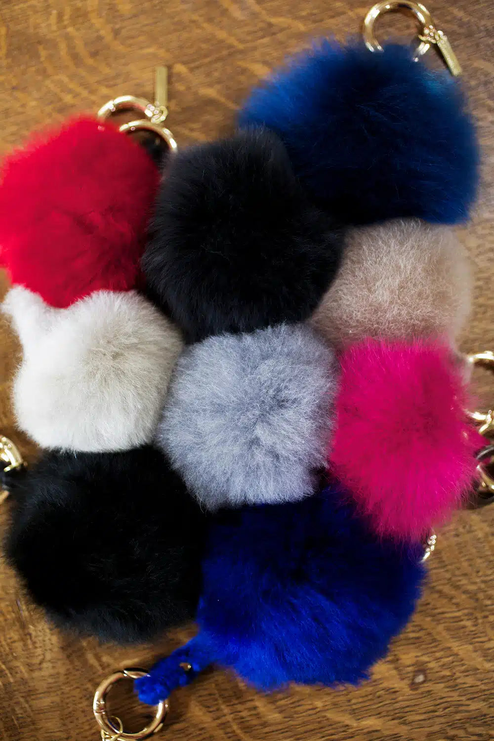 Lacorine alpaca fur pom pom keyring in vibrant mixed colors, featuring soft, plush alpaca fur for a stylish accessory.