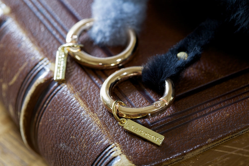 Lacorine alpaca fur pom pom keyring in various colors, soft and fluffy accessory for keys or bags.