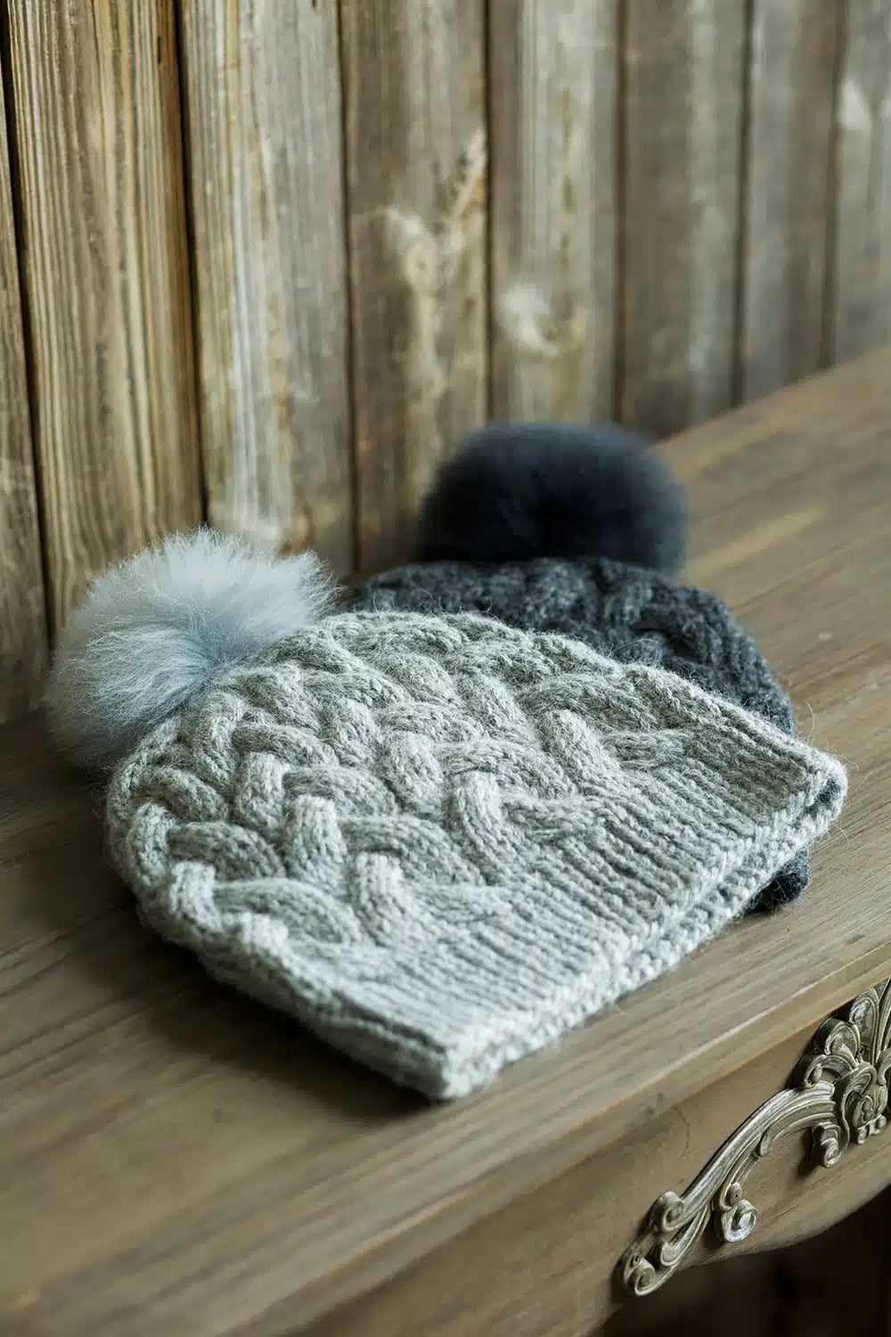 Lacorine silver-grey alpaca beanie hat with a pom-pom and matching headband, cozy and stylish for cold weather.