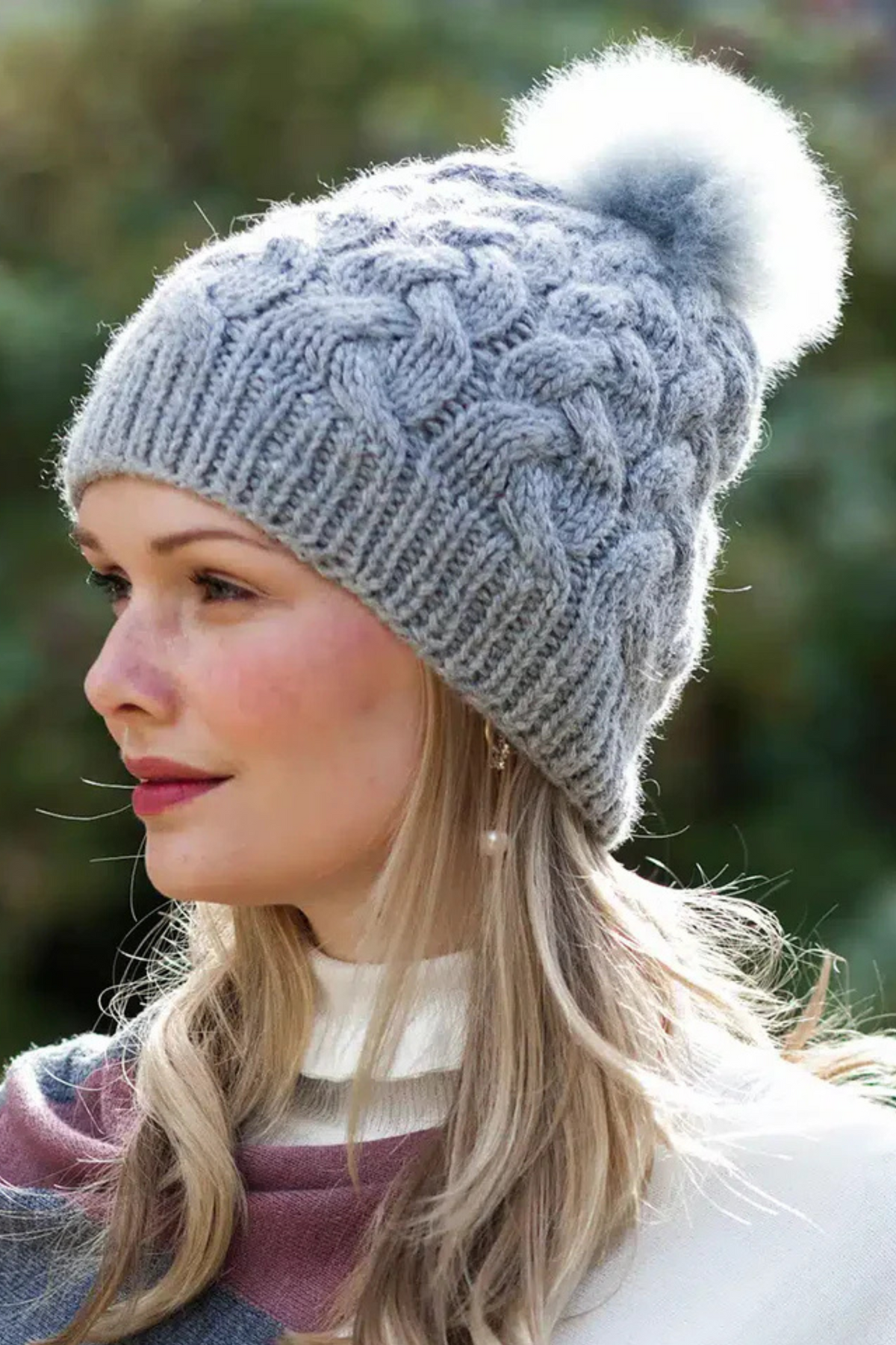 Silver grey Lacorine pom pom alpaca beanie hat with a matching headband, featuring soft, cozy alpaca fiber and a playful pom pom top.