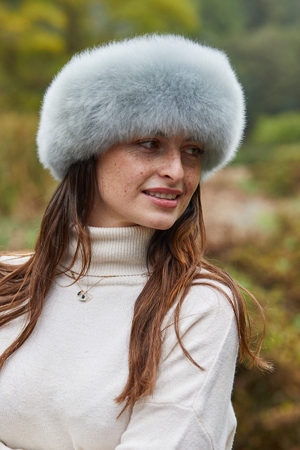Ice blue luxury alpaca fur headband by Lacorine, showcasing soft, plush alpaca fur and stylish design for cold weather warmth.