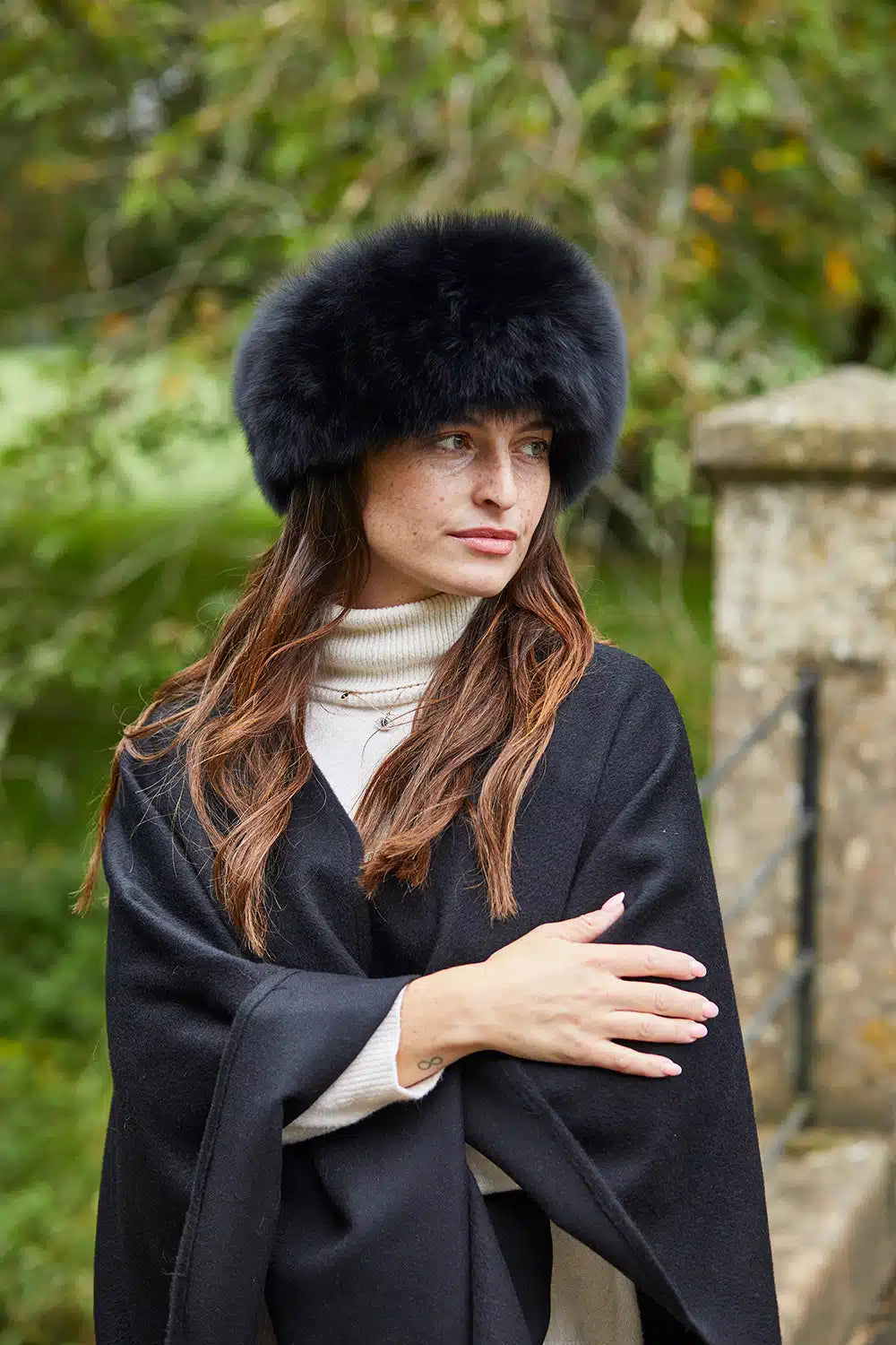 Black luxury alpaca fur headband from Lacorine, stylish and warm accessory with soft, plush alpaca fur for cold weather.