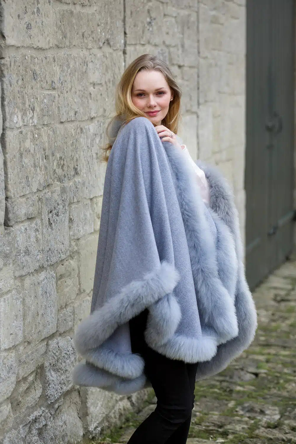 Grey Annabelle Fur Trimmed Alpaca Cape by Lacorine, featuring soft alpaca fabric with elegant fur trim details.