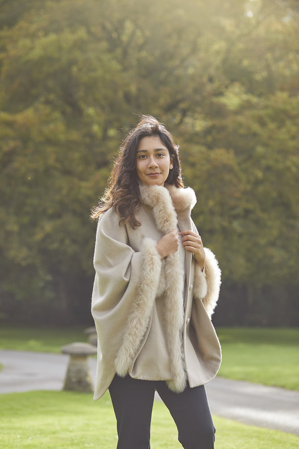 Beige Lacorine fur-trimmed alpaca cape coat showcasing a cozy, elegant outerwear piece with plush fur accents.
