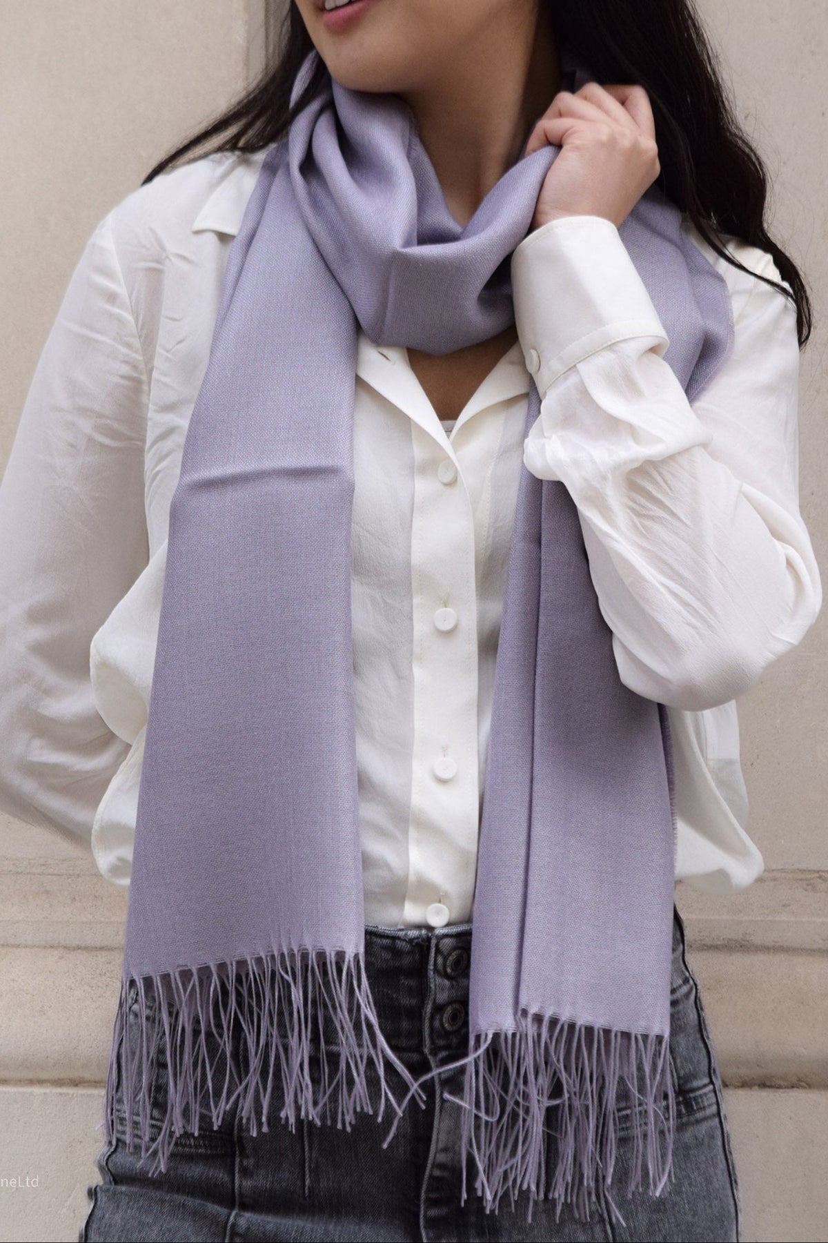 Lilac Lacorine Signature Pashmina knitwear shawl draped elegantly, showcasing soft texture and luxurious craftsmanship.