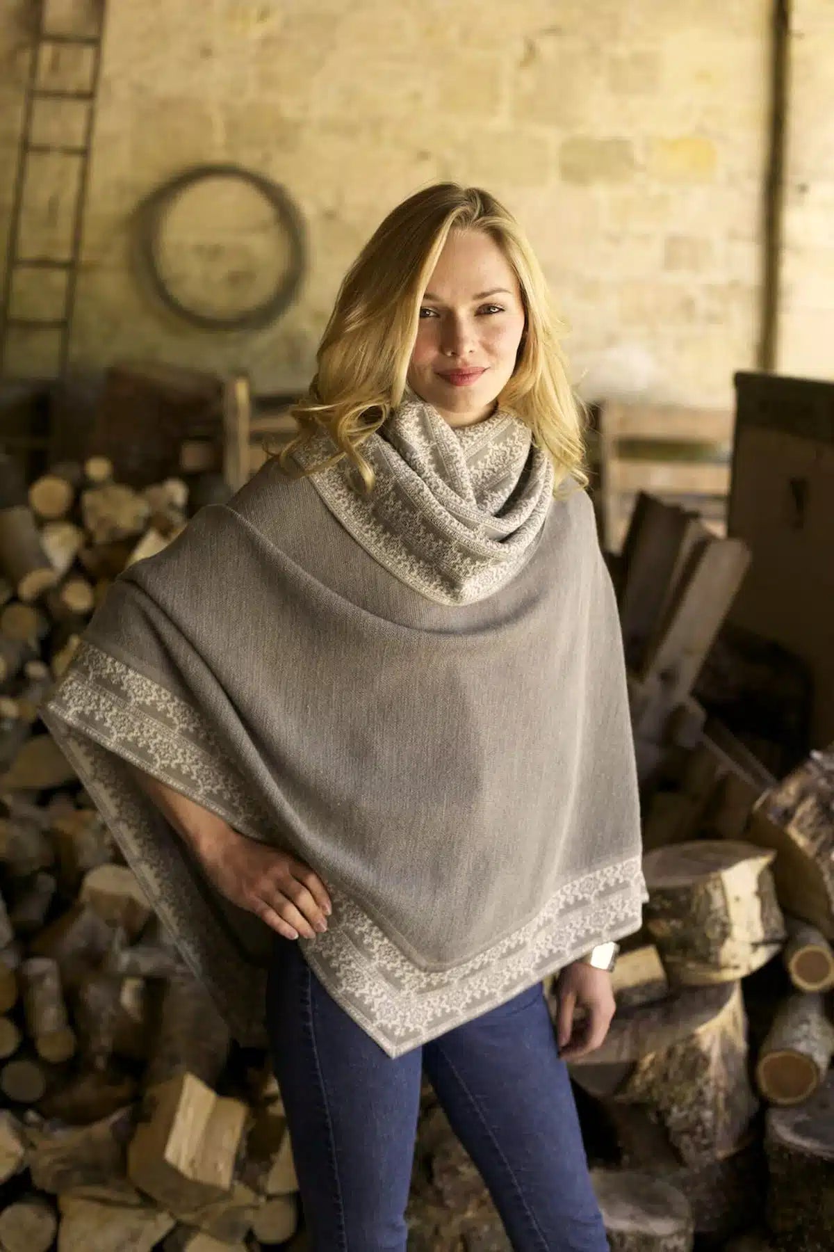 Elegant women's Valentina Alpaca Poncho by Lacorine, featuring soft, warm alpaca fabric and a stylish, draped design.