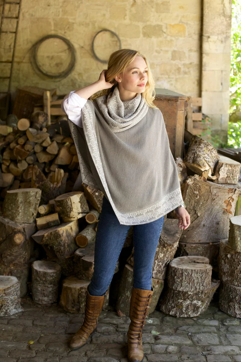 Lacorine Valentina Alpaca Poncho in soft, luxurious beige with a cozy, draped design, showcasing sustainable alpaca fabric.