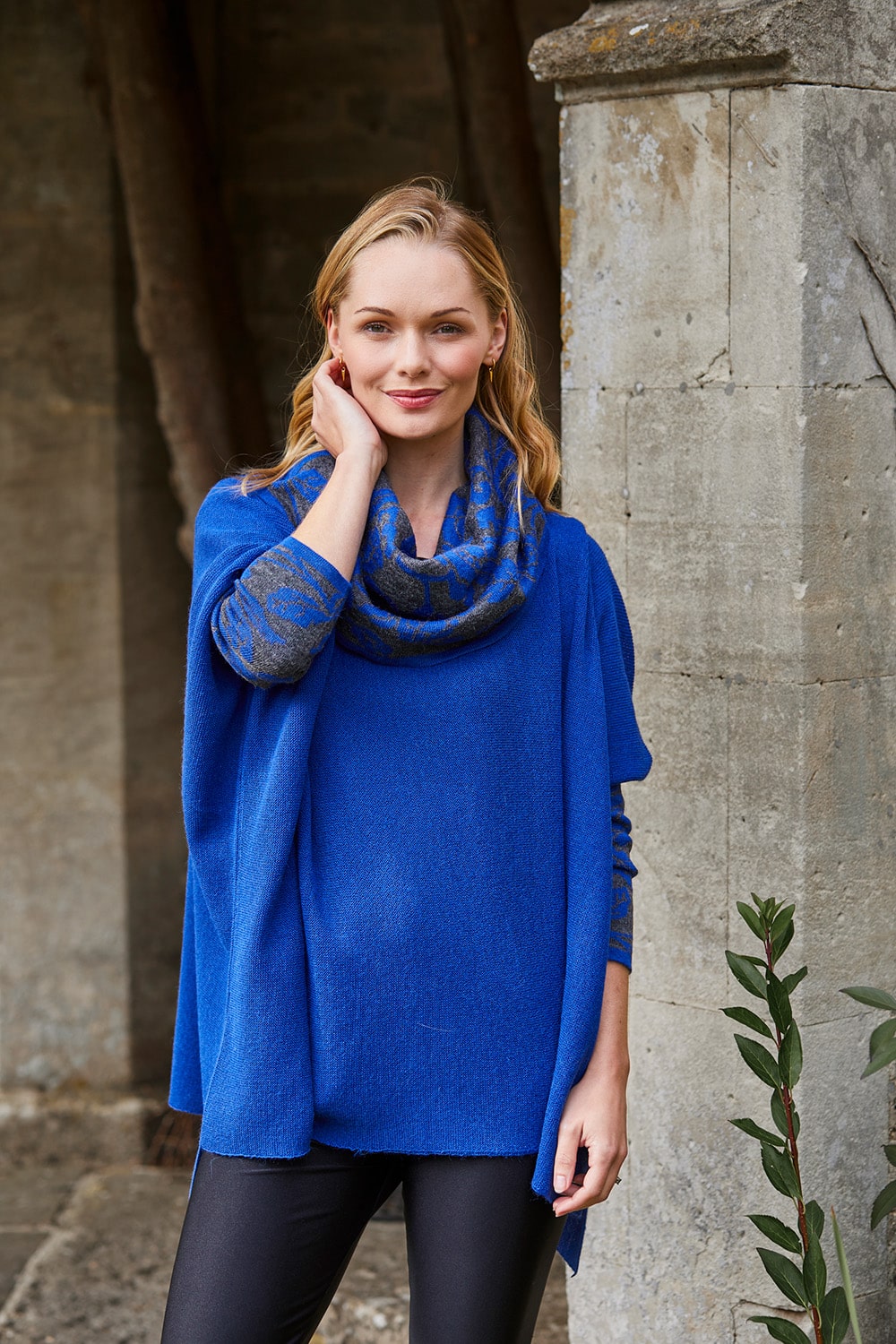 Lacorine Primavera alpaca poncho in cobalt blue and grey with a cozy, woven design, perfect for stylish warmth.