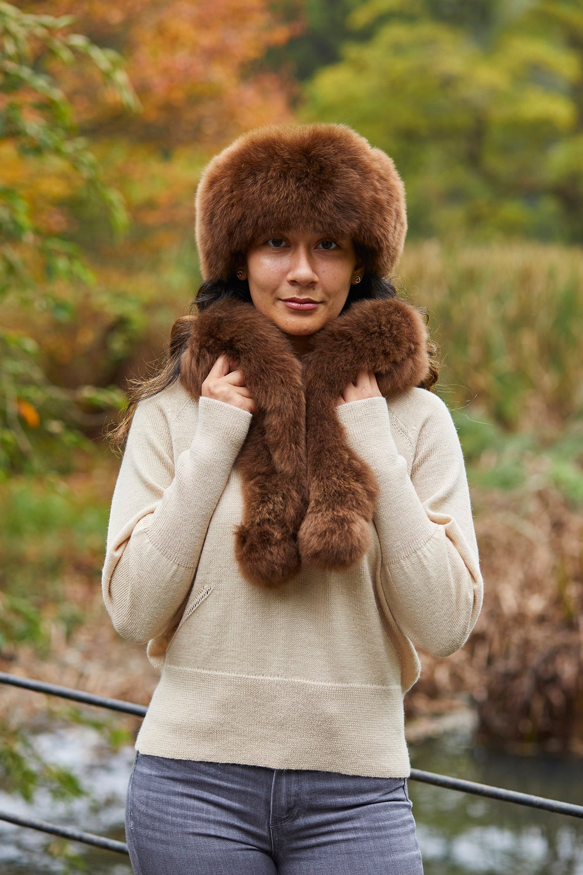 Luxury chocolate alpaca fur scarf by Lacorine, soft and warm with plush alpaca fibers, shown with matching hat in the image.