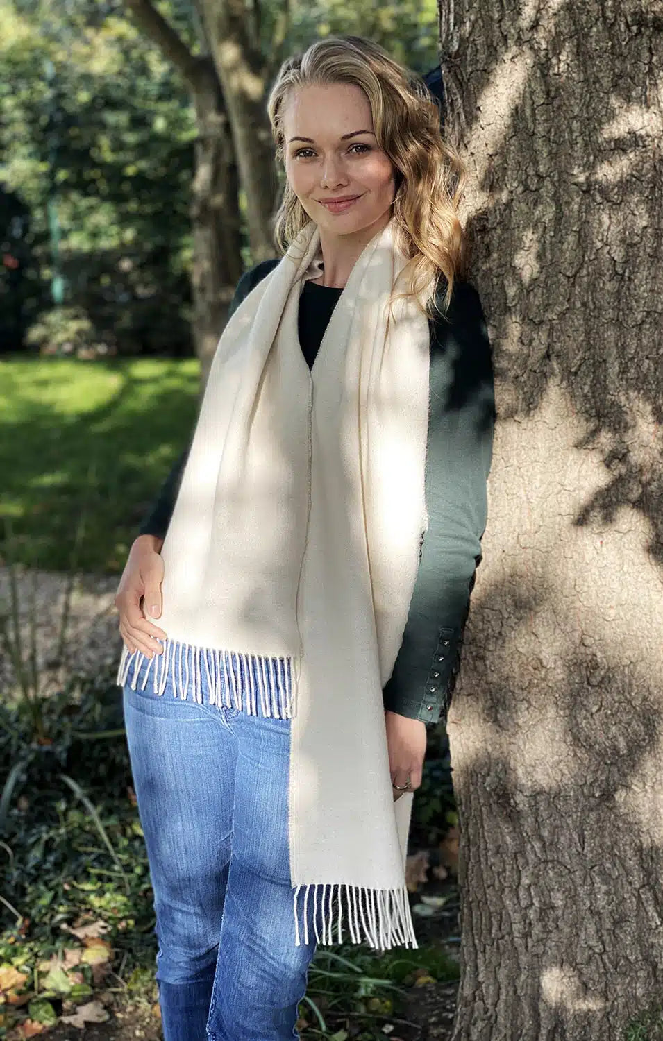 Lacorine fine alpaca knit scarf showing soft, cozy beige fabric with intricate knit pattern, ideal for cold weather accessories.