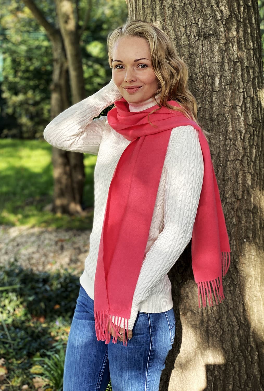 Pink Lacorine fine alpaca knit scarf draped gracefully, showcasing soft, luxurious wool with a cozy, stylish texture.
