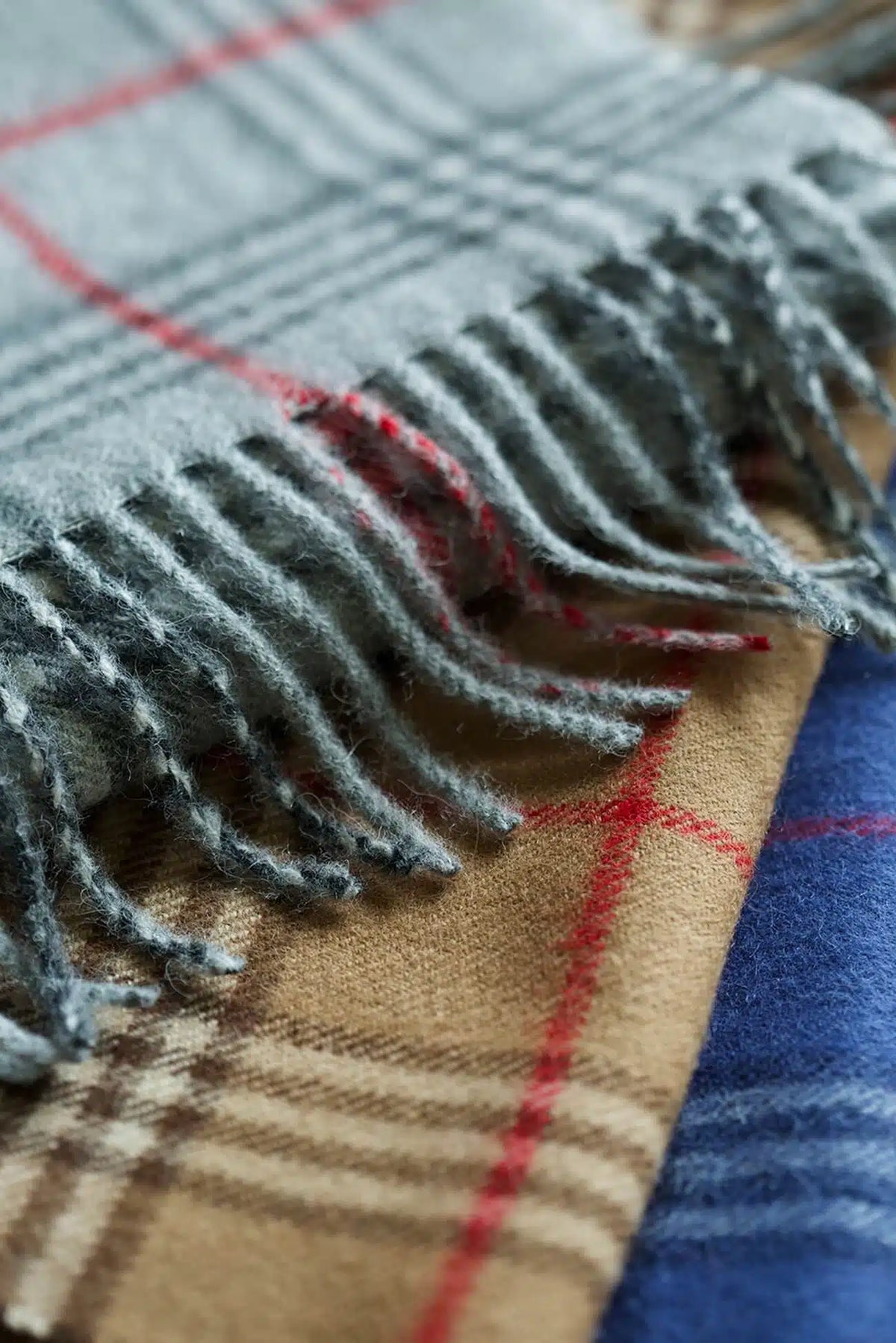 Lacorine check alpaca wool scarf with a soft, cozy woven pattern in various colors, lightweight and stylish for cold weather.