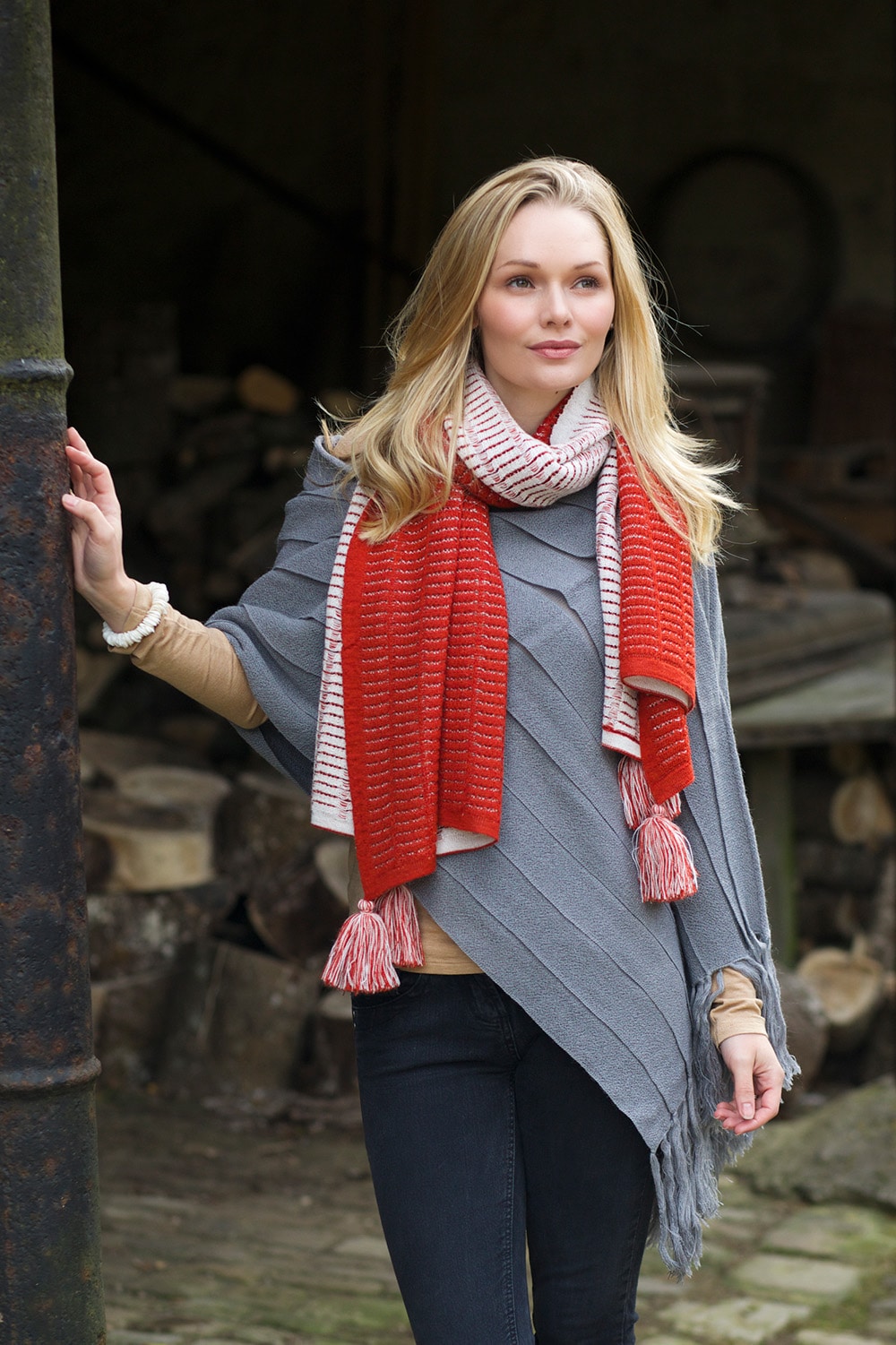 Lacorine Natalia oversized alpaca scarf in orange and white, soft and warm with a cozy, chunky knit texture.