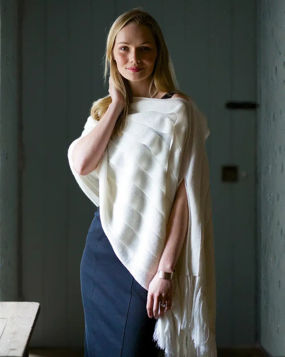 Cream luxury wool shawl by Lacorine, featuring soft texture and elegant drape, perfect for stylish warmth and comfort.