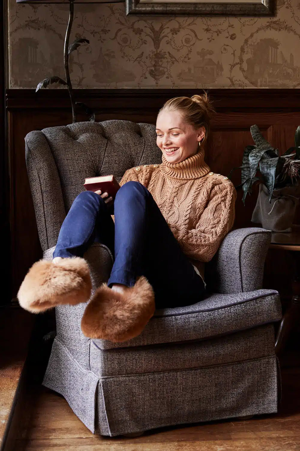 Lacorine alpaca fur slippers with copper-colored plush exterior and soft interior, designed for cozy comfort.