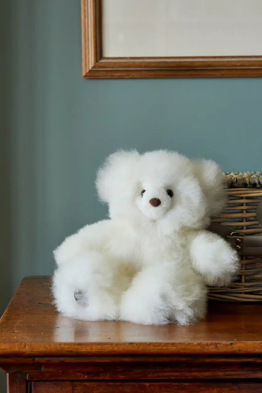 White Super Luxe Corinne Alpaca Fur Teddy Bear by Lacorine, plush and soft, featuring detailed stitching and a cozy appearance.