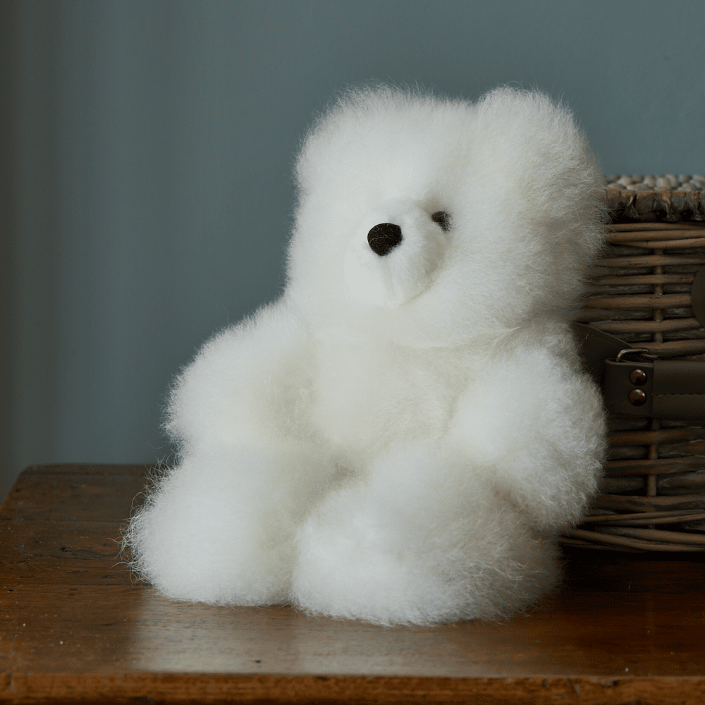 White Charles Alpaca Fur Teddy Bear by Lacorine, small plush toy with soft alpaca fur and detailed stitching.