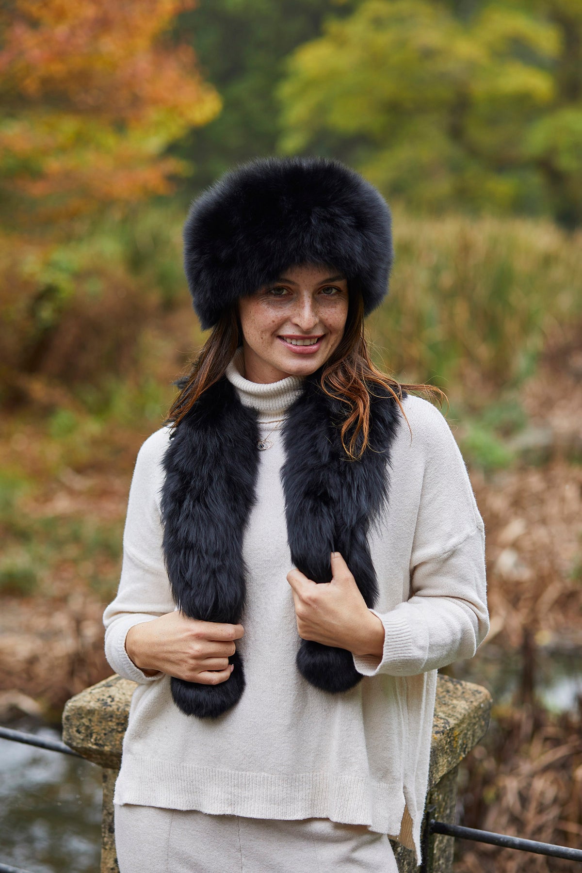 Black Twizzle alpaca fur scarf worn with a matching black alpaca fur hat