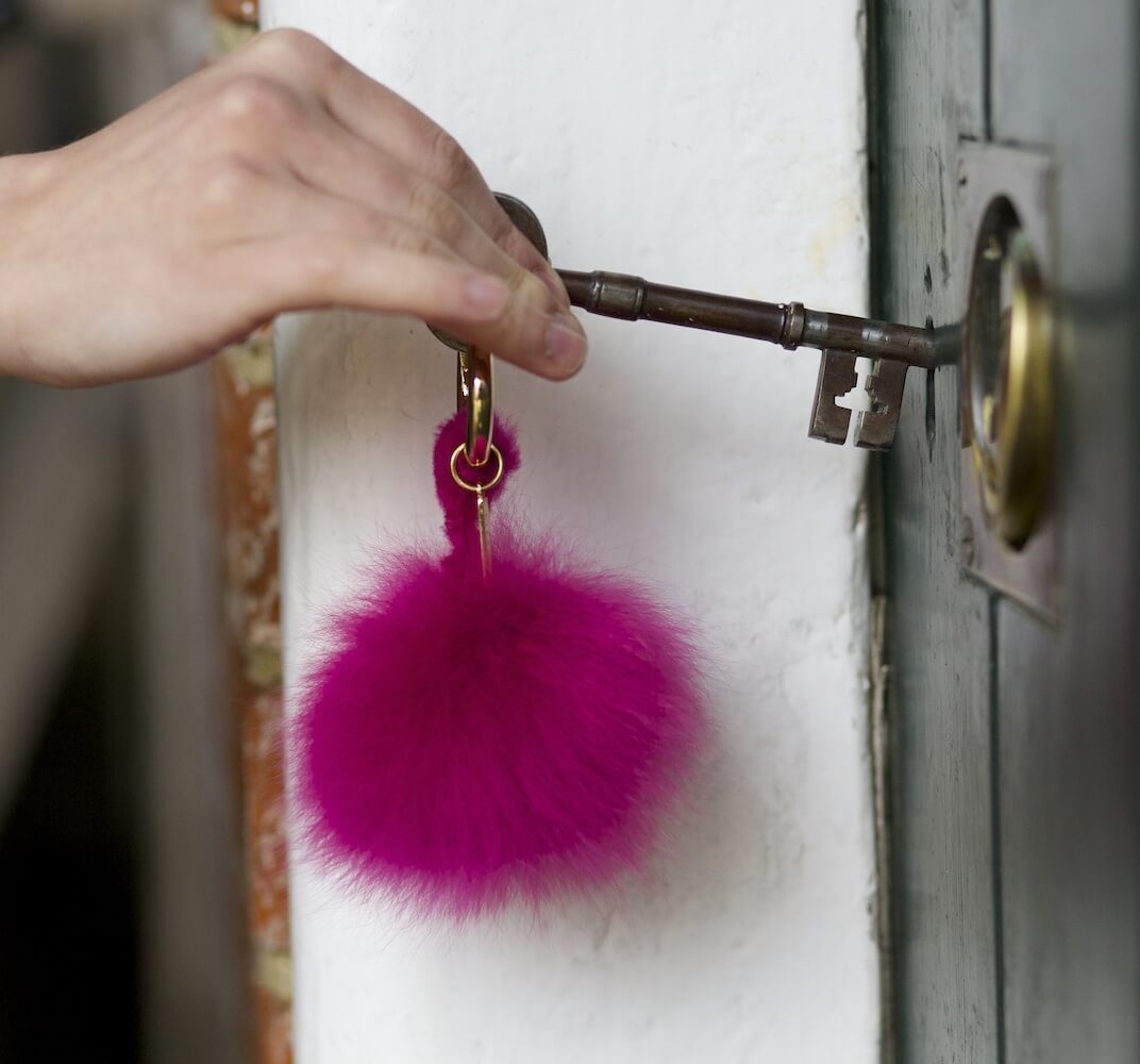 Lacorine alpaca fur pom pom keyring featuring soft, fluffy alpaca fur for a stylish accessory.