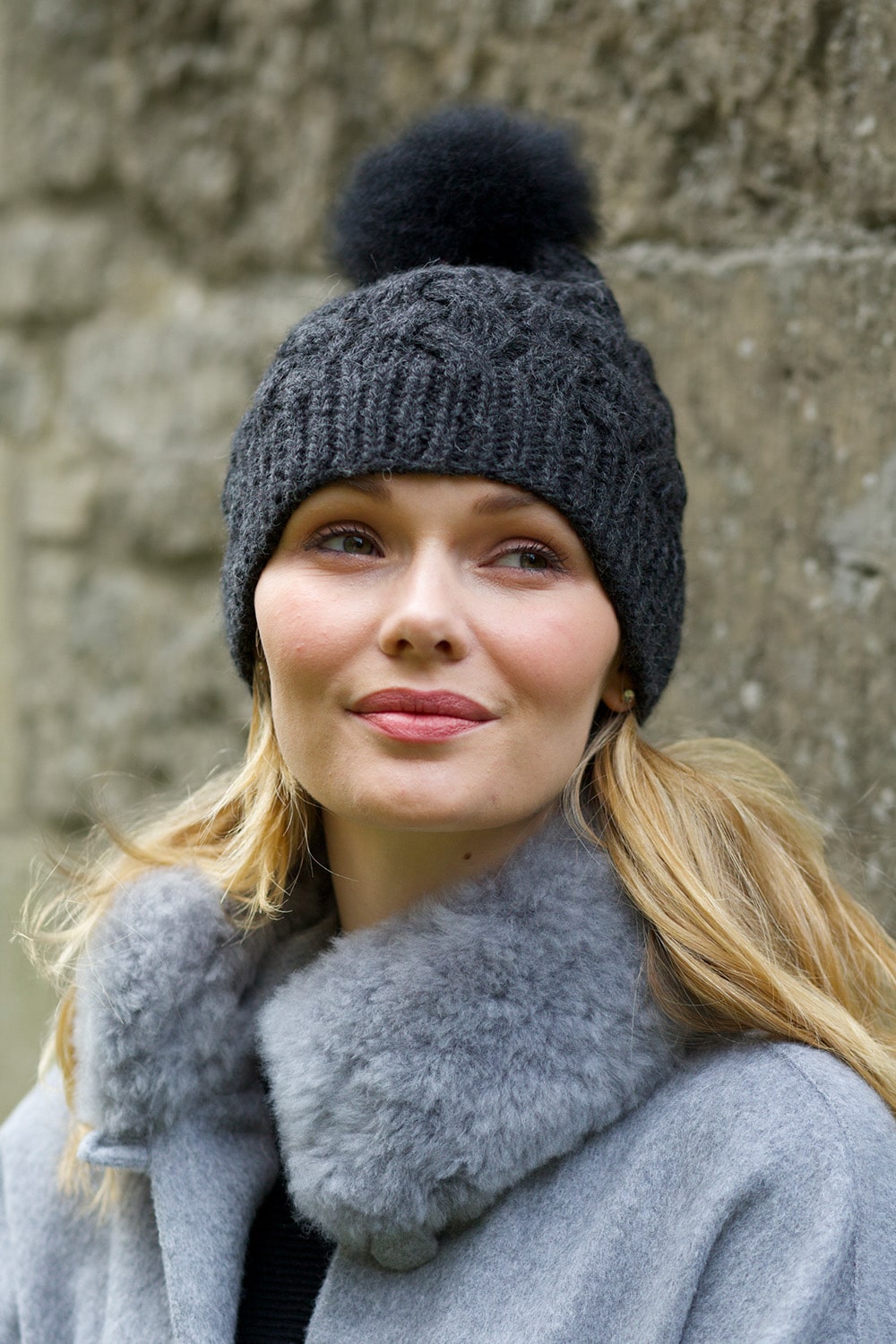 Charcoal Lacorine pom pom alpaca beanie hat with a cozy knit design and matching headband, perfect for cold weather.