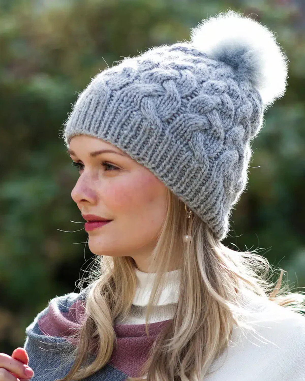 Silver grey Lacorine pom pom alpaca beanie hat with a matching headband, featuring soft, cozy alpaca fiber and a playful pom pom top.