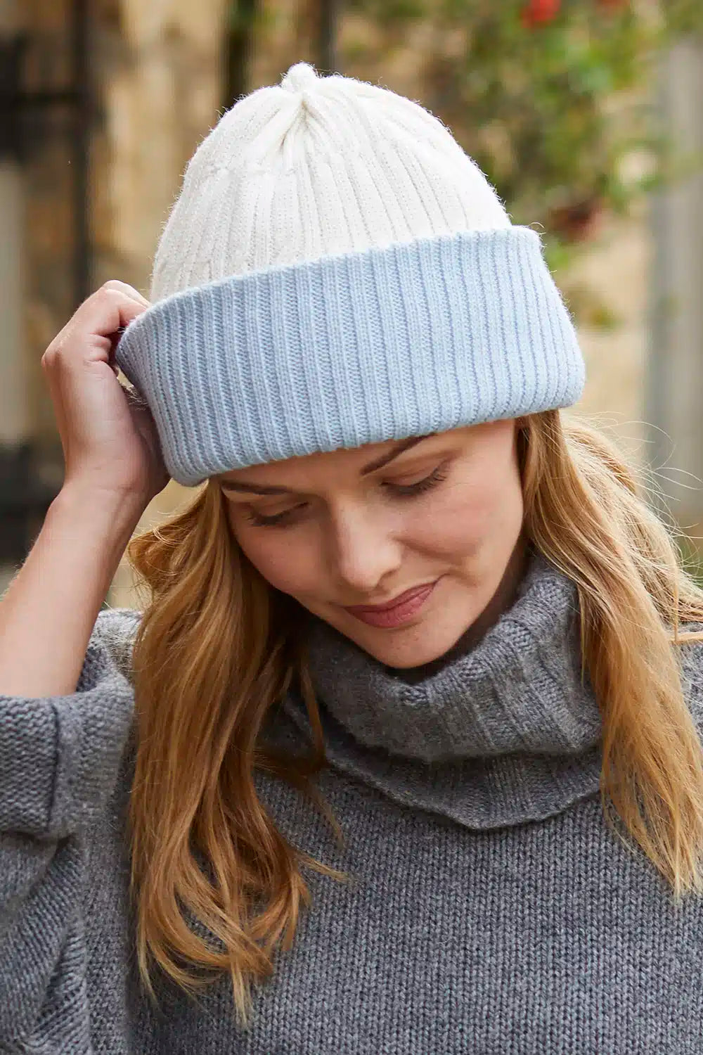 Baby-blue alpaca wool beanie hat with a matching headband, designed for warmth and comfort by Lacorine.