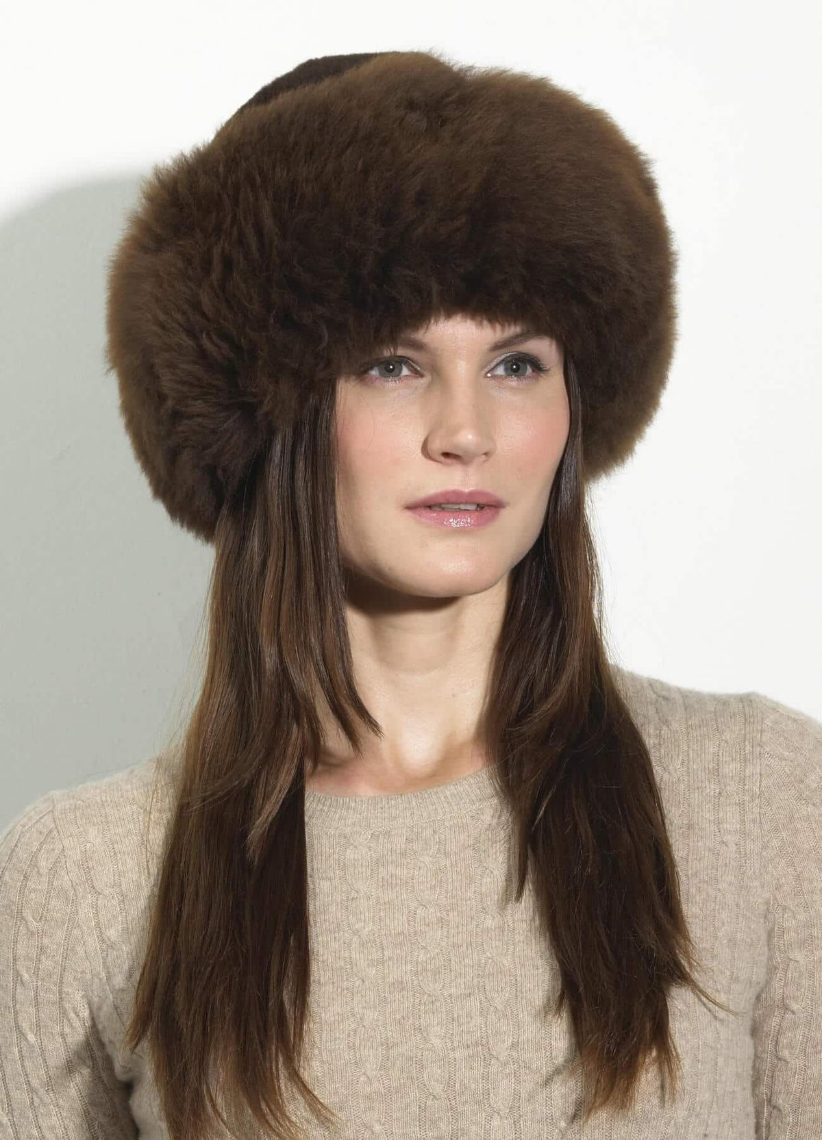 Luxury chocolate brown Qori alpaca fur hat and headband by Lacorine, showcasing soft, plush alpaca fur for warmth and style.