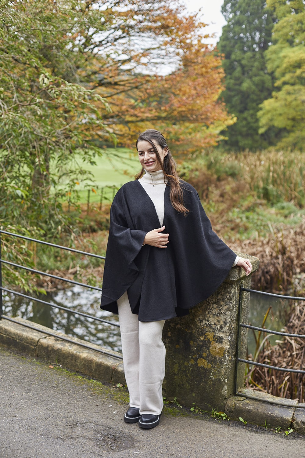 Grey and black classic alpaca wool cape by Lacorine, featuring soft, warm fabric and elegant drape for stylish winter wear.