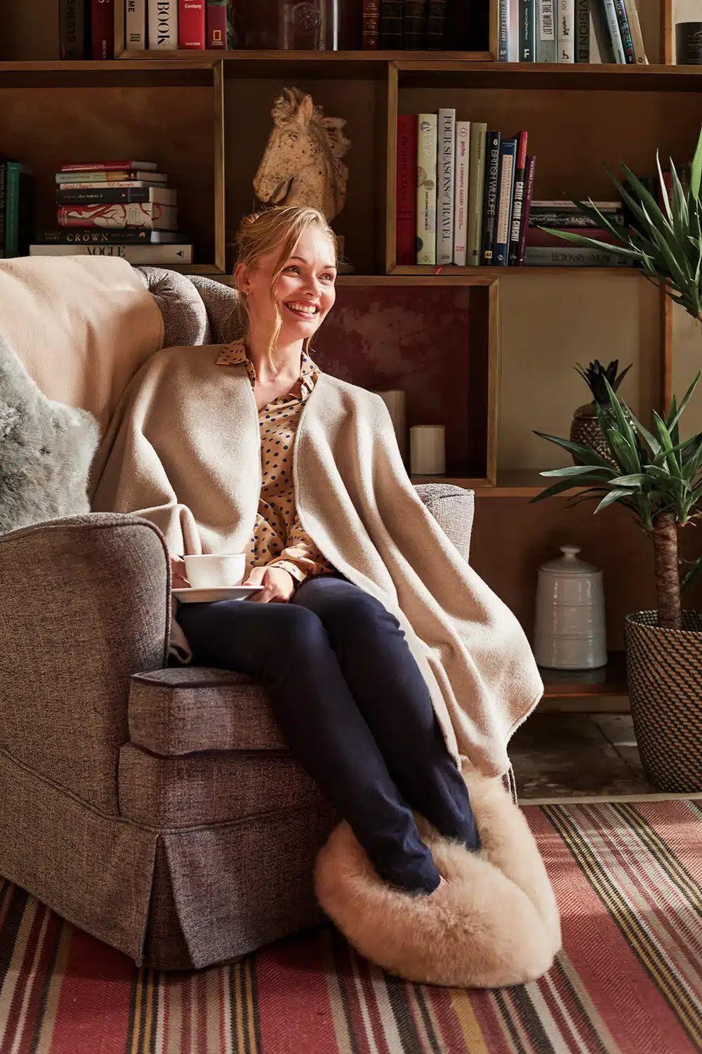 Taupe Lacorine classic alpaca wool cape draped elegantly, showcasing its cozy, luxurious texture and stylish design.