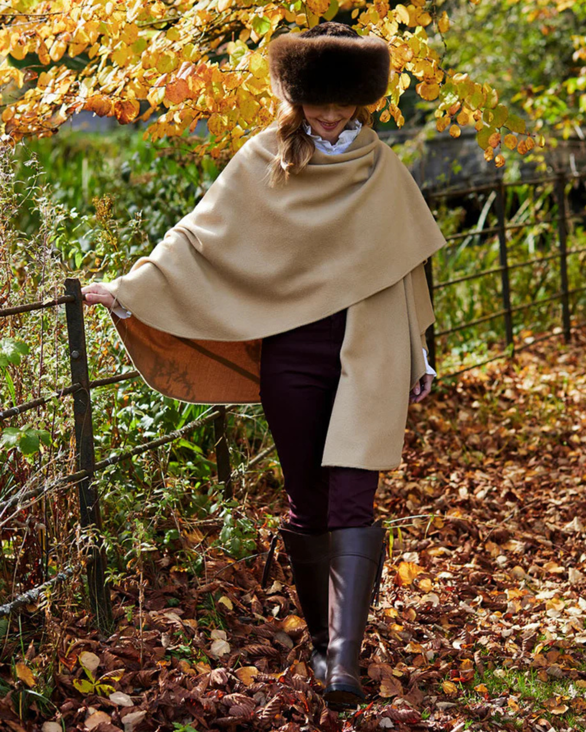 Lacorine classic alpaca wool cape draped over a mannequin, showcasing its soft texture and stylish design.