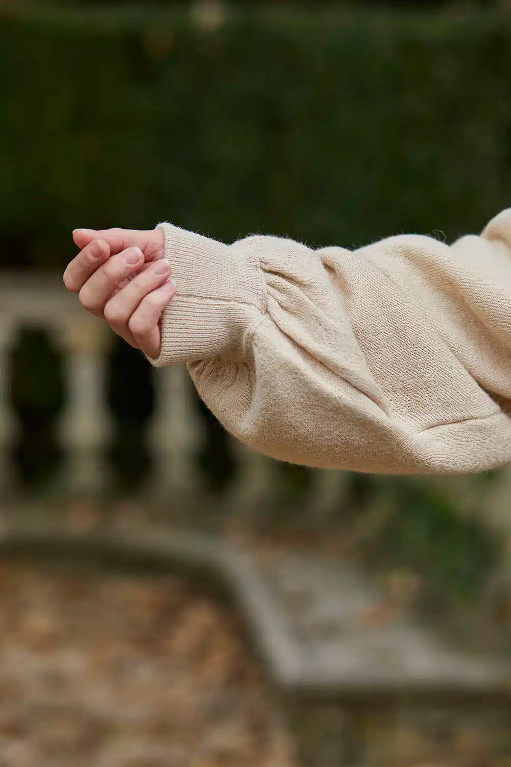 Beige Lacorine Cecile Alpaca Cardigan with button details, soft knit fabric, and classic design for cozy, stylish wear.