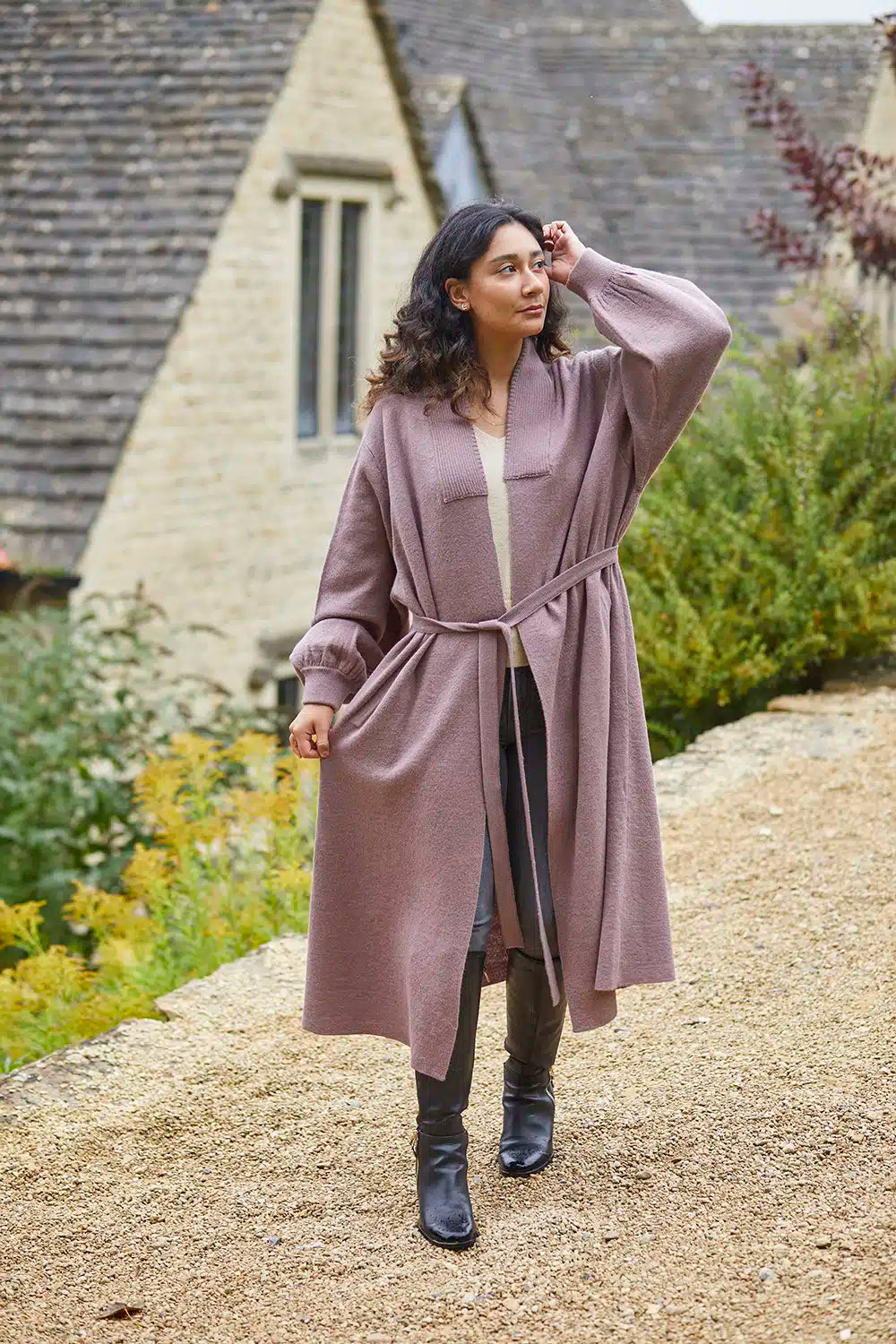 Beige Lacorine Cecile Alpaca Cardigan displayed on a model, showcasing its cozy knit and relaxed fit.