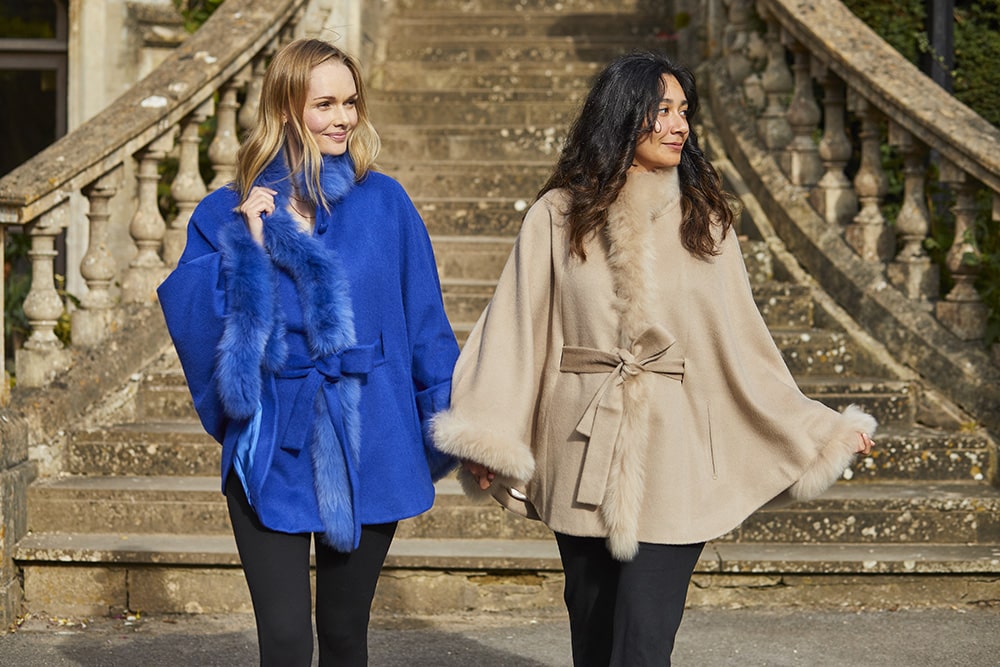 Lacorine luxury alpaca coat with fur trim, featuring a stylish cape design and sustainable, soft alpaca wool.