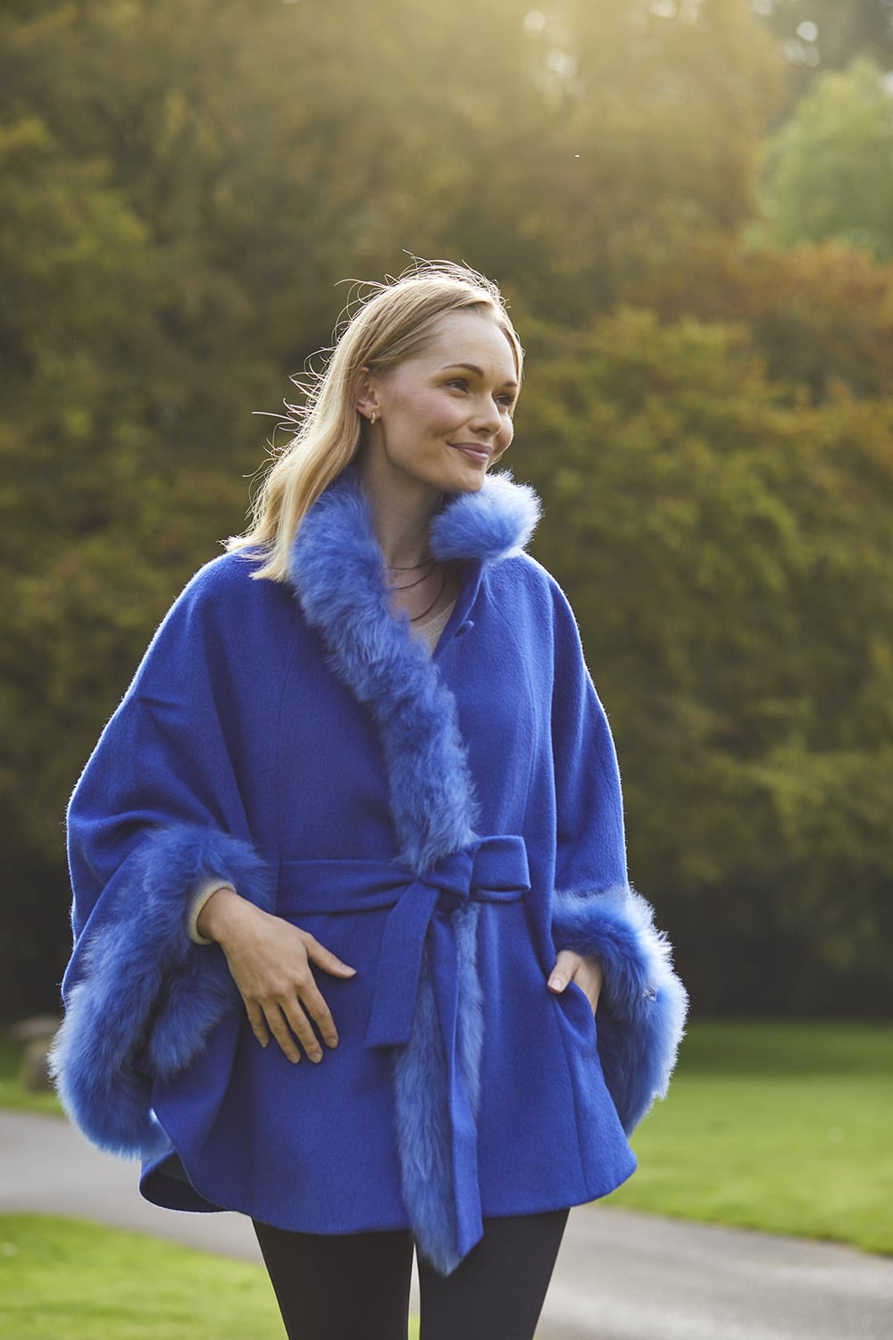 Lacorine Lucia alpaca coat with luxurious fur trim, showcasing a cozy, elegant winter cape in soft wool and fur accents.