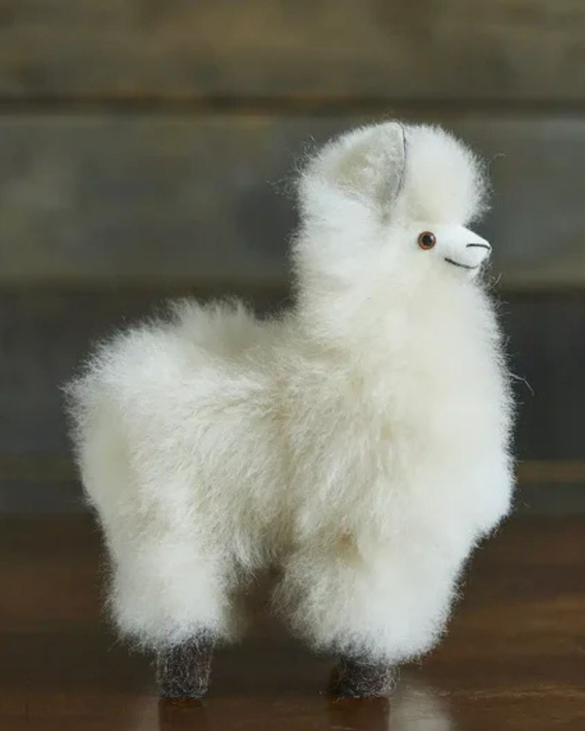 White mini alpaca fur collectable by Lacorine, soft and fluffy plush toy with detailed fur texture.