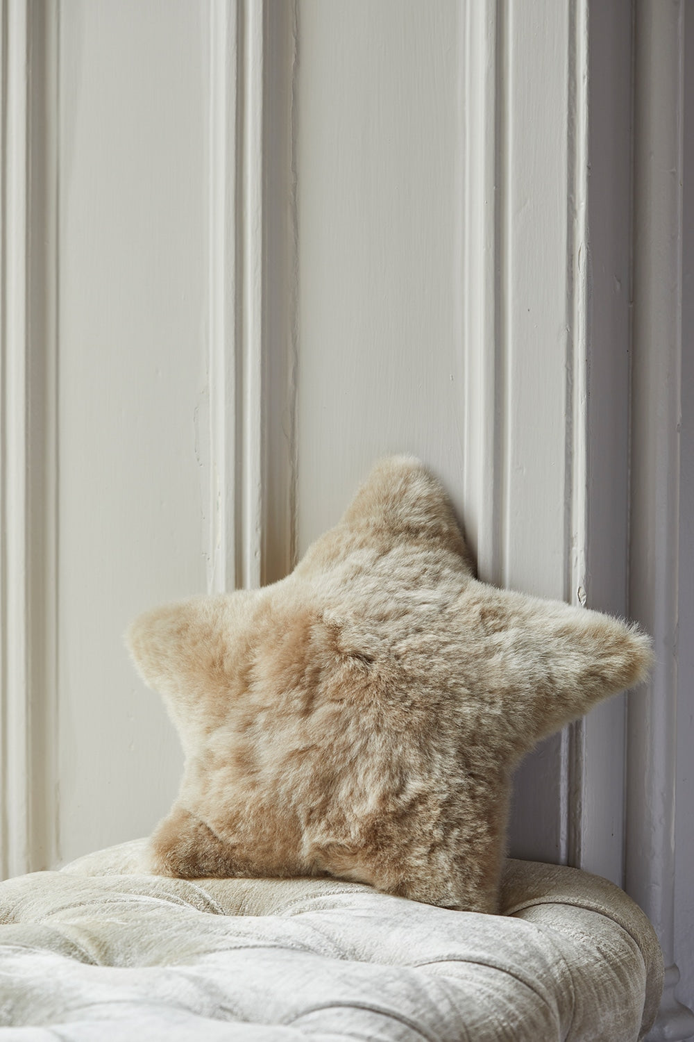 Lacorine alpaca fur star cushion with soft, plush texture, ideal for cozy home decor and decorative seating.