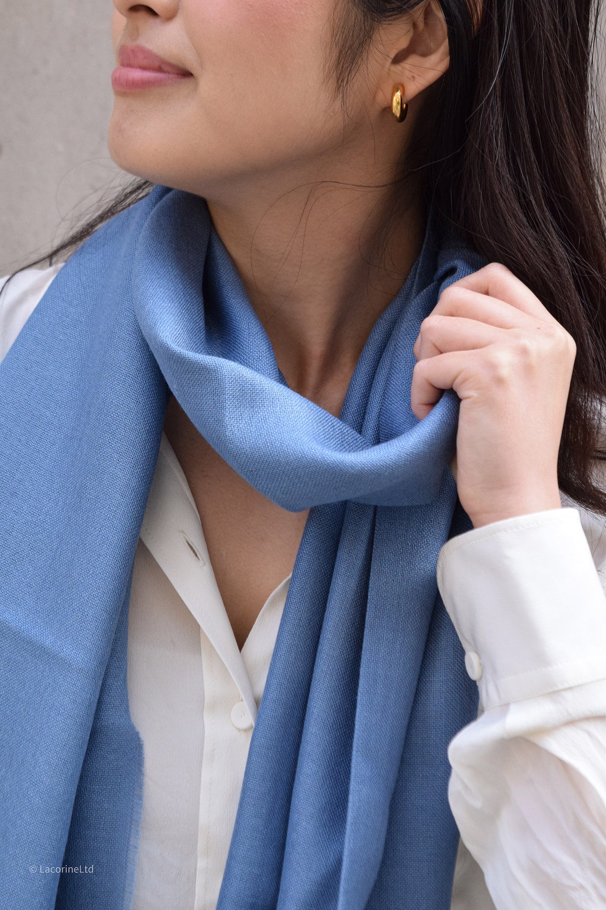 Close-up of a light blue Lacorine Signature Pashmina knitwear highlighting soft, cozy fabric and fine craftsmanship.
