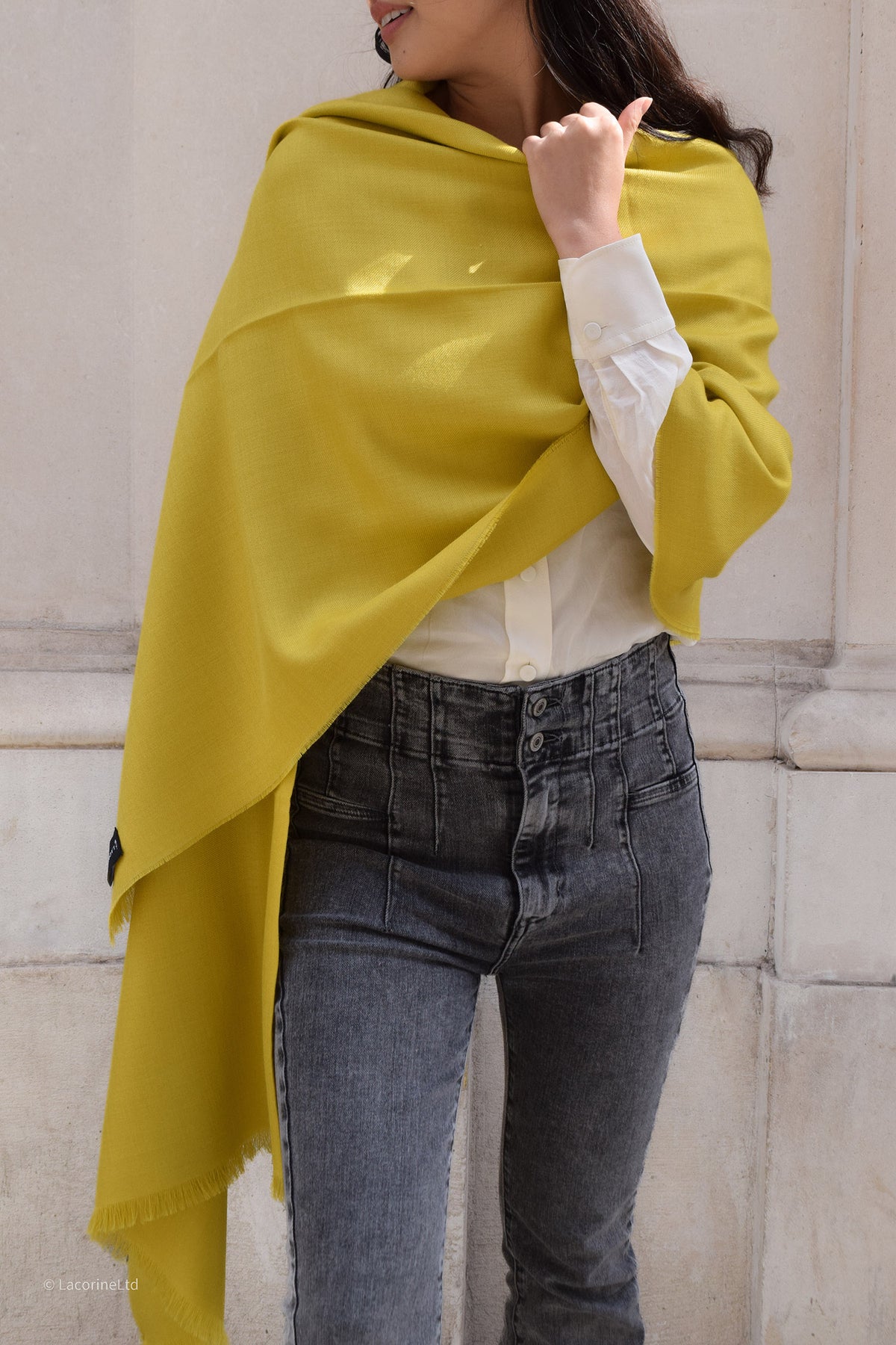Yellow Lacorine Royal Alpaca Pashmina knitwear displayed flat, showcasing its soft texture and vibrant color.