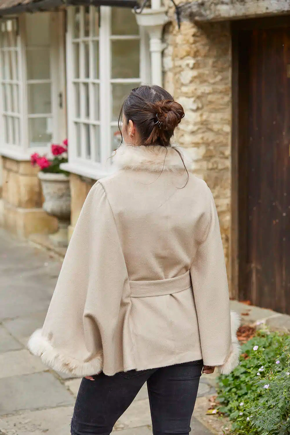 Cream beige fur-trimmed alpaca poncho by Lacorine, showcasing soft alpaca fabric with plush fur trim at the back.