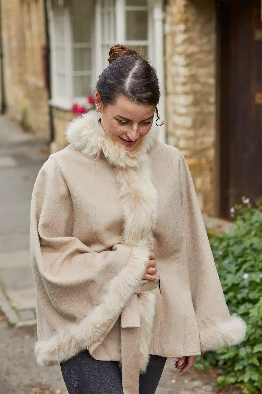 Cream beige Felicity fur-trimmed alpaca poncho by Lacorine, showing soft alpaca fabric with luxurious fur trim.