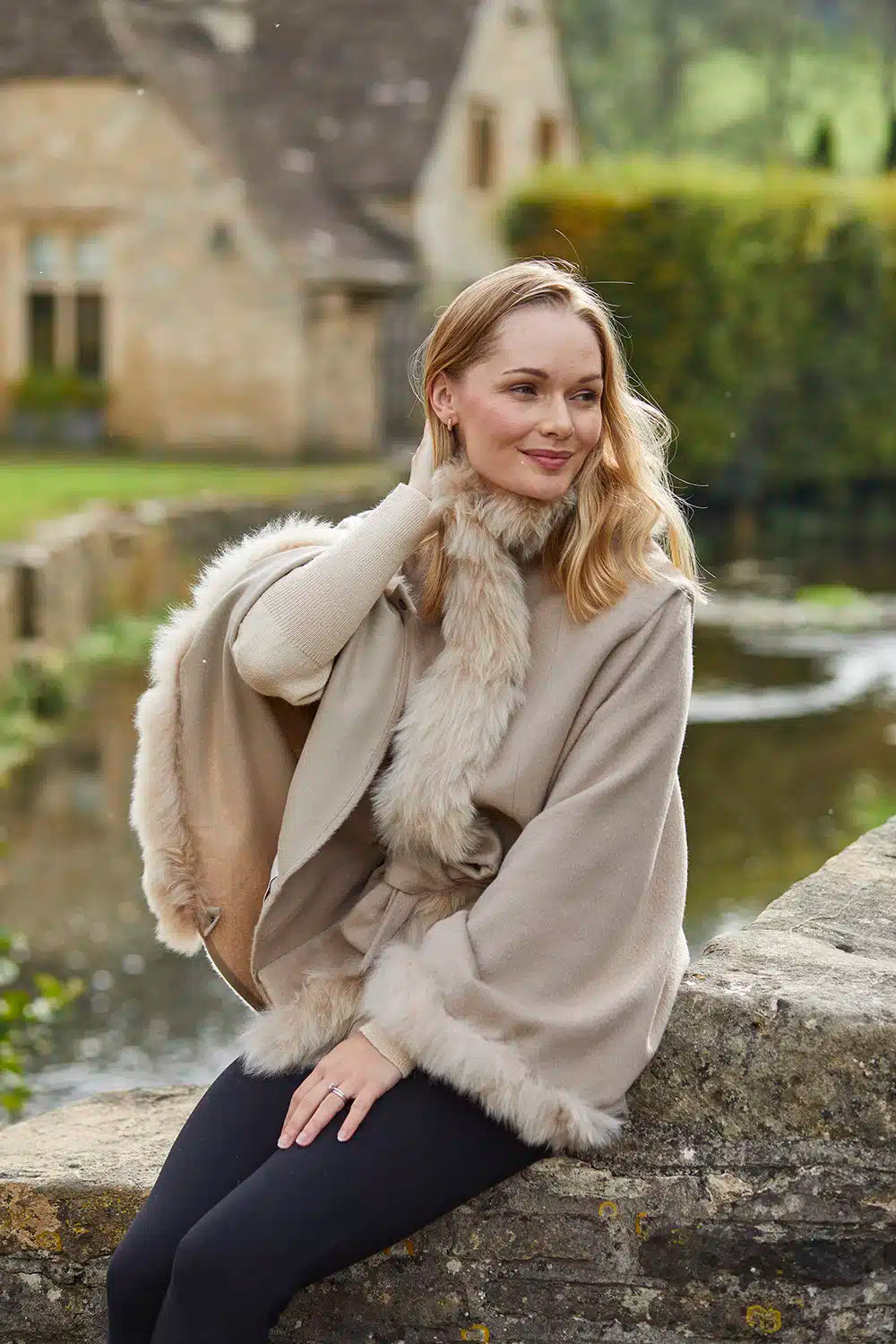Cream Felicity Fur Trimmed Alpaca Poncho by Lacorine, featuring soft alpaca fabric with luxurious fur trim for cozy style.