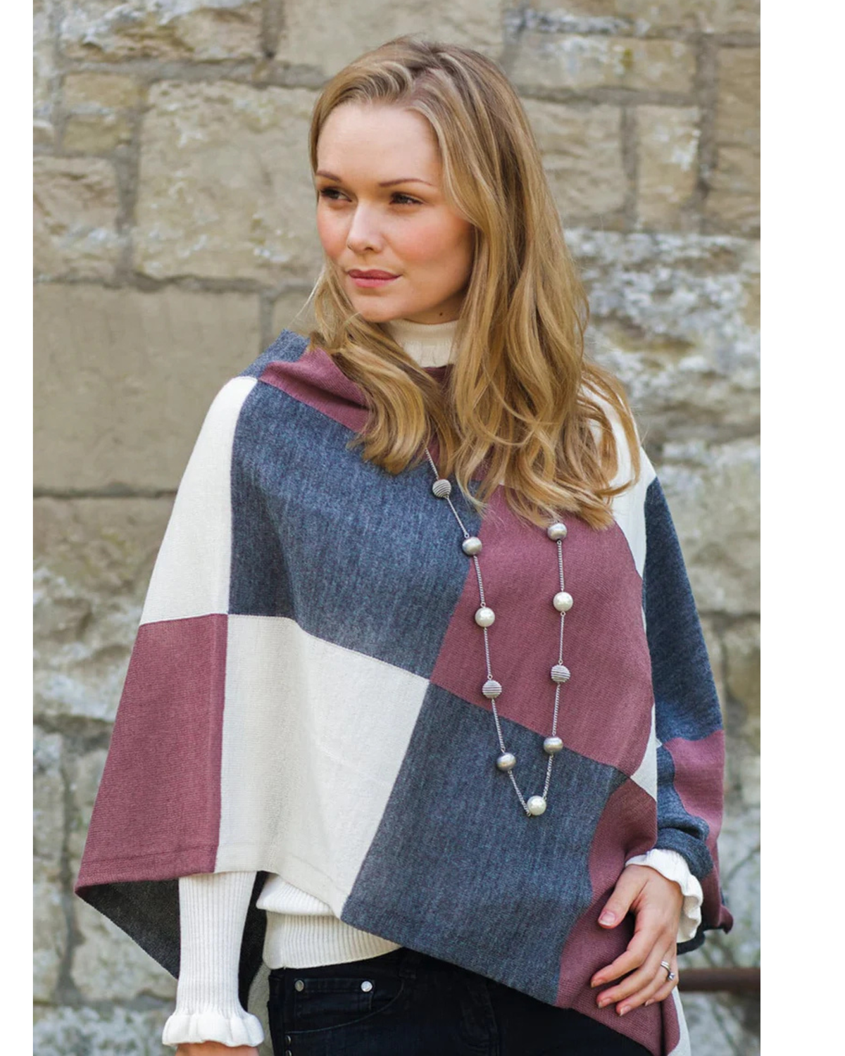Lacorine Portofino alpaca poncho showcasing soft, cozy fabric with a stylish drape and detailed knit pattern.