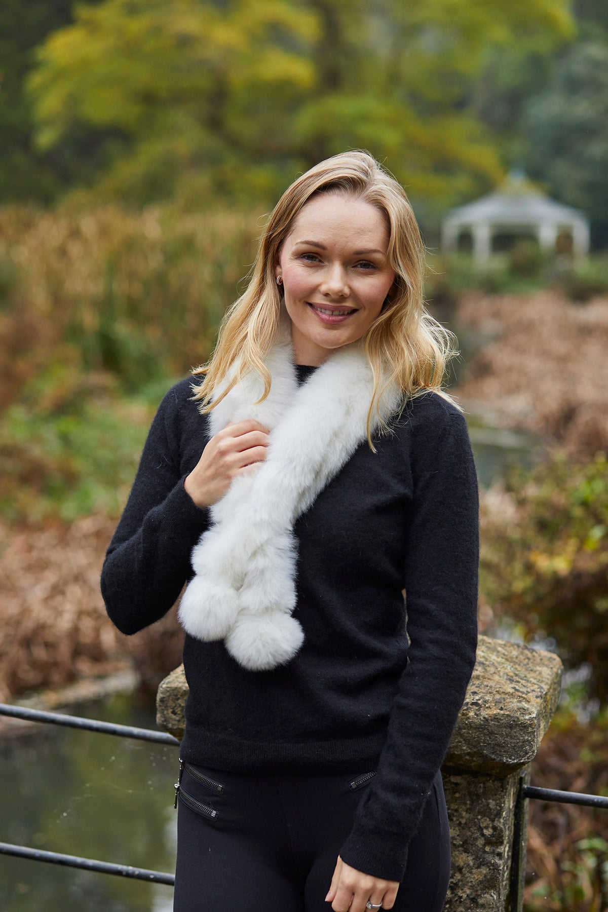 White luxury Twizzle alpaca fur scarf by Lacorine, showcasing soft plush texture and elegant drape.