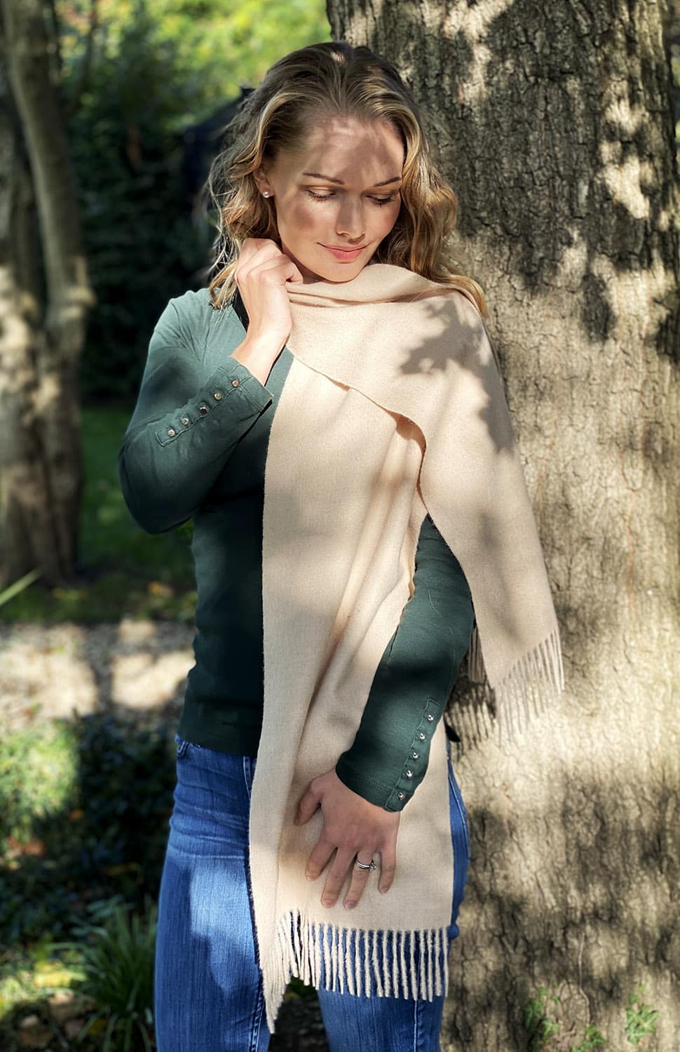 Cream-colored Alpaca Knit Scarf by Lacorine, showcasing soft, cozy, fine alpaca material with a textured knit pattern.
