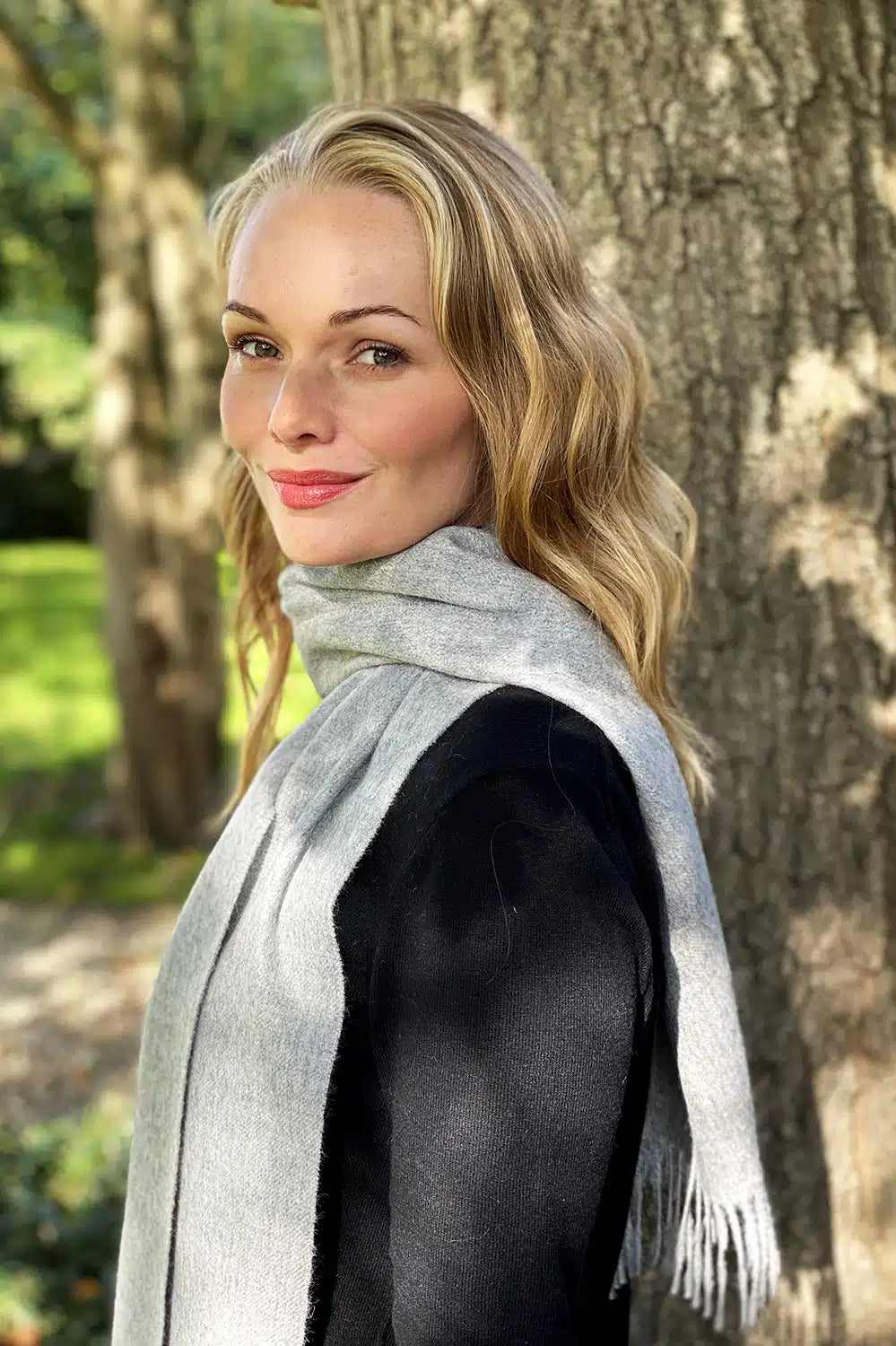 Soft grey alpaca knit scarf by Lacorine, cozy winter accessory with fine, warm wool texture and elegant drape.