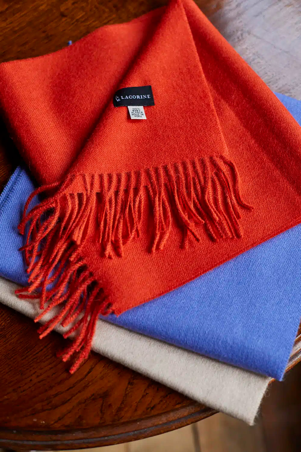 Lacorine fine alpaca knit scarf in soft, warm beige with a lightweight, cozy texture, perfect for stylish winter wear.