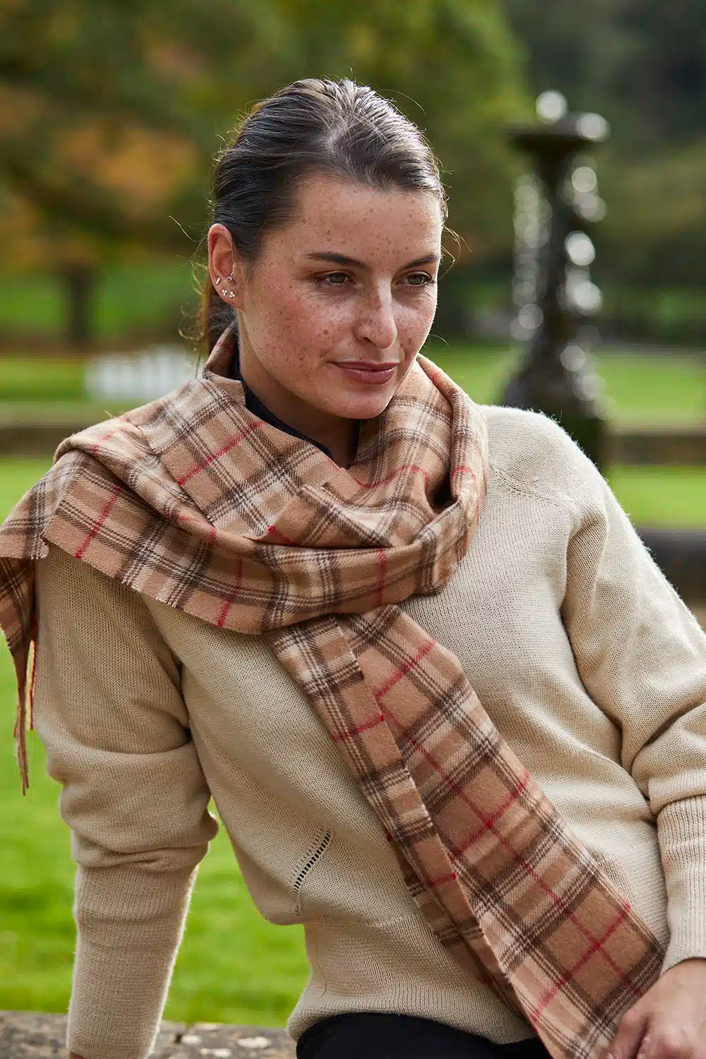 Camel check alpaca wool scarf from Lacorine featuring a soft, warm, and stylish pattern suitable for cold weather wear.