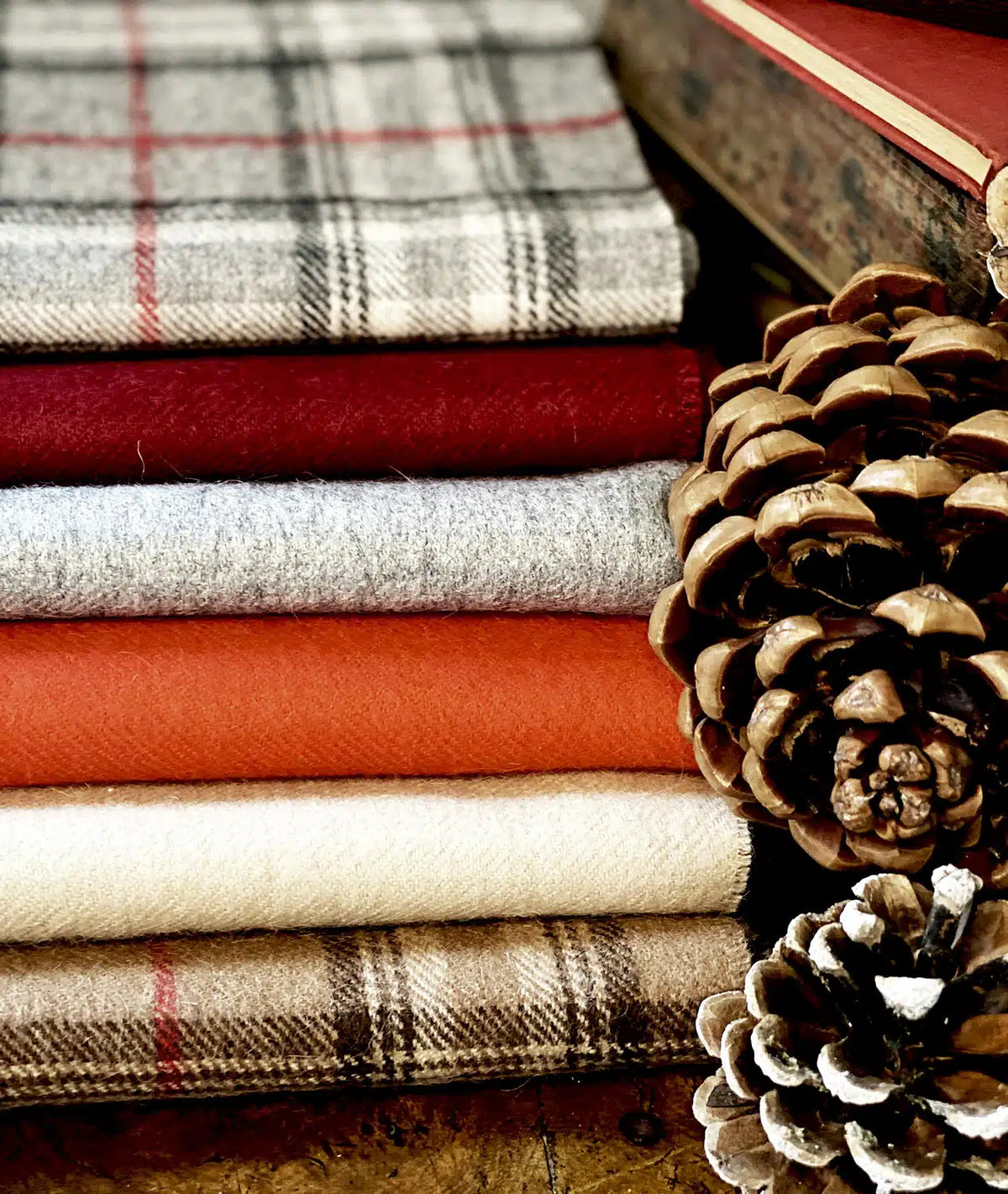 Lacorine check alpaca wool scarf featuring a soft, cozy plaid pattern in warm tones, perfect for stylish winter wear.