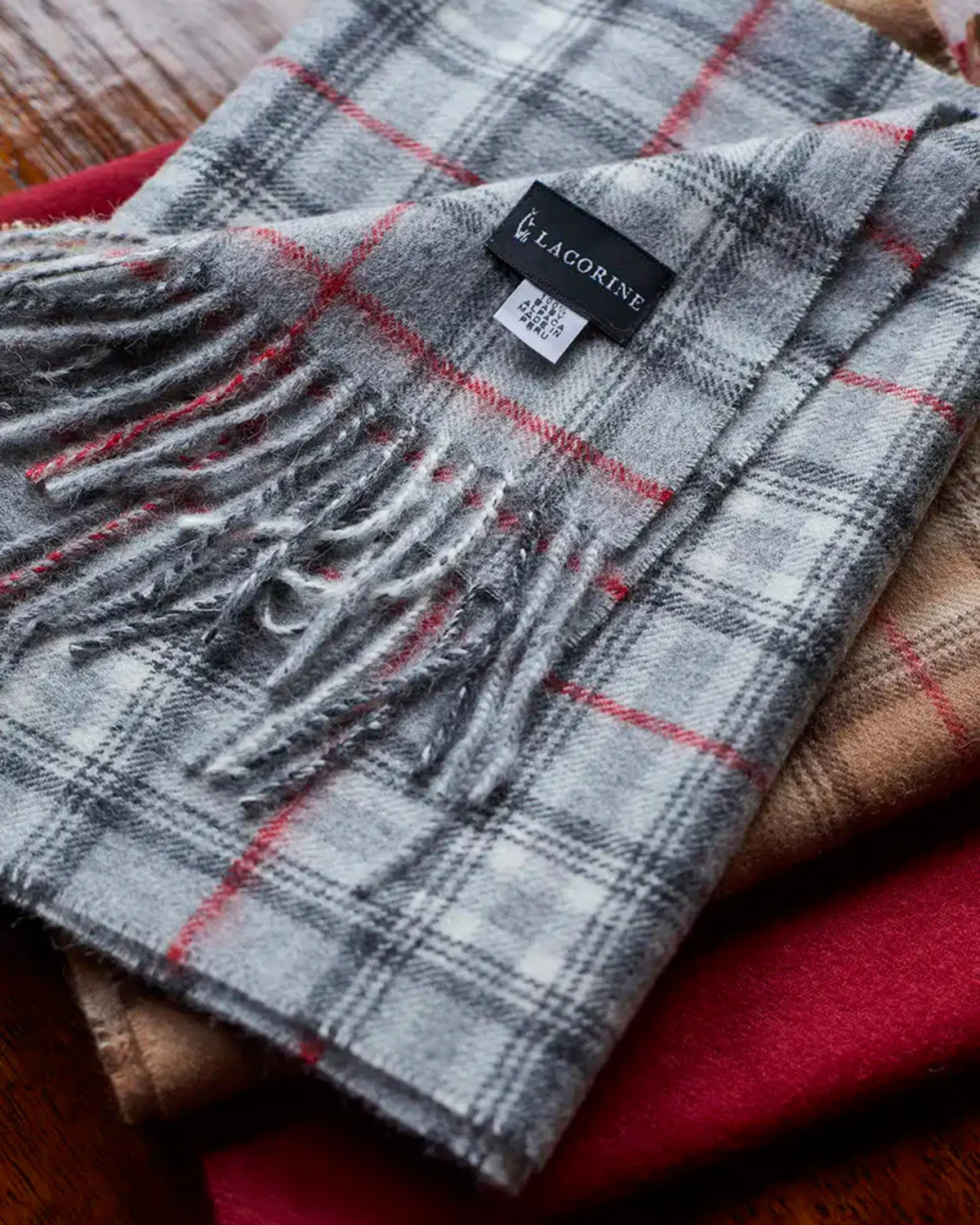 Lacorine check alpaca wool scarf with classic plaid pattern, soft and warm accessory for cold weather.