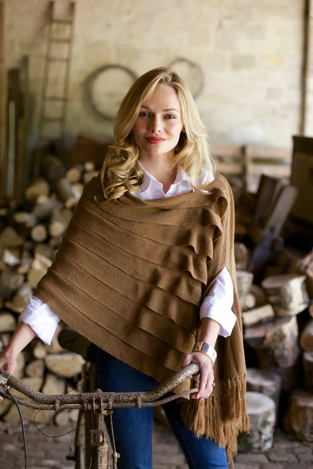 Dark camel Lacorine Emperatriz luxury wool shawl draped elegantly, showcasing its soft texture and stylish design.